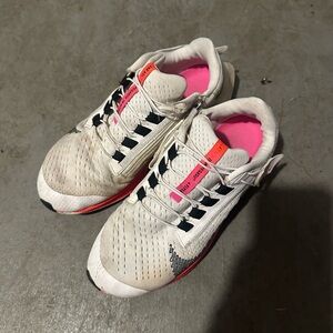 White Athletic Running Shoes with Pink Accents